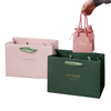 Custom Print Private Label Embossed Logo Golden Foil Green Coated Cardboard Cosmetic Perfume Private Label Small Goodie Gift Bag